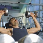 Man Weightlifting on Bench With Dumbbells