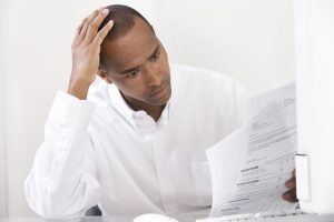 man studying a nonprofit grant proposal