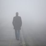 Man walking in the fog