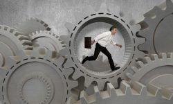 Man walking through gears in circles