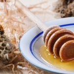 Plate of honey with honeycombs 