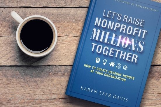 Lets Raise Millions Together Book on table