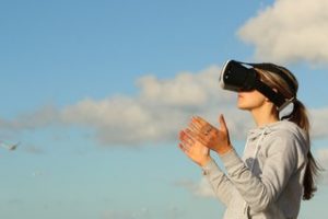 a woman looking thru VR lens