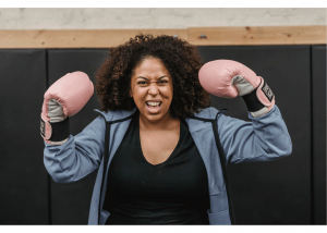 Excited woman with boxing gloves