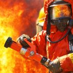 Firefighter surrounded by flames