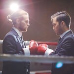 2 men in a boxing ring in suits, decorative