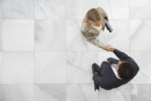 man and woman shaking hands