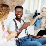 People visiting and holding drinks