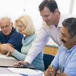 People working at a board meeting