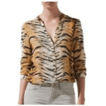 a woman in a shirt with a tiger skin pattern